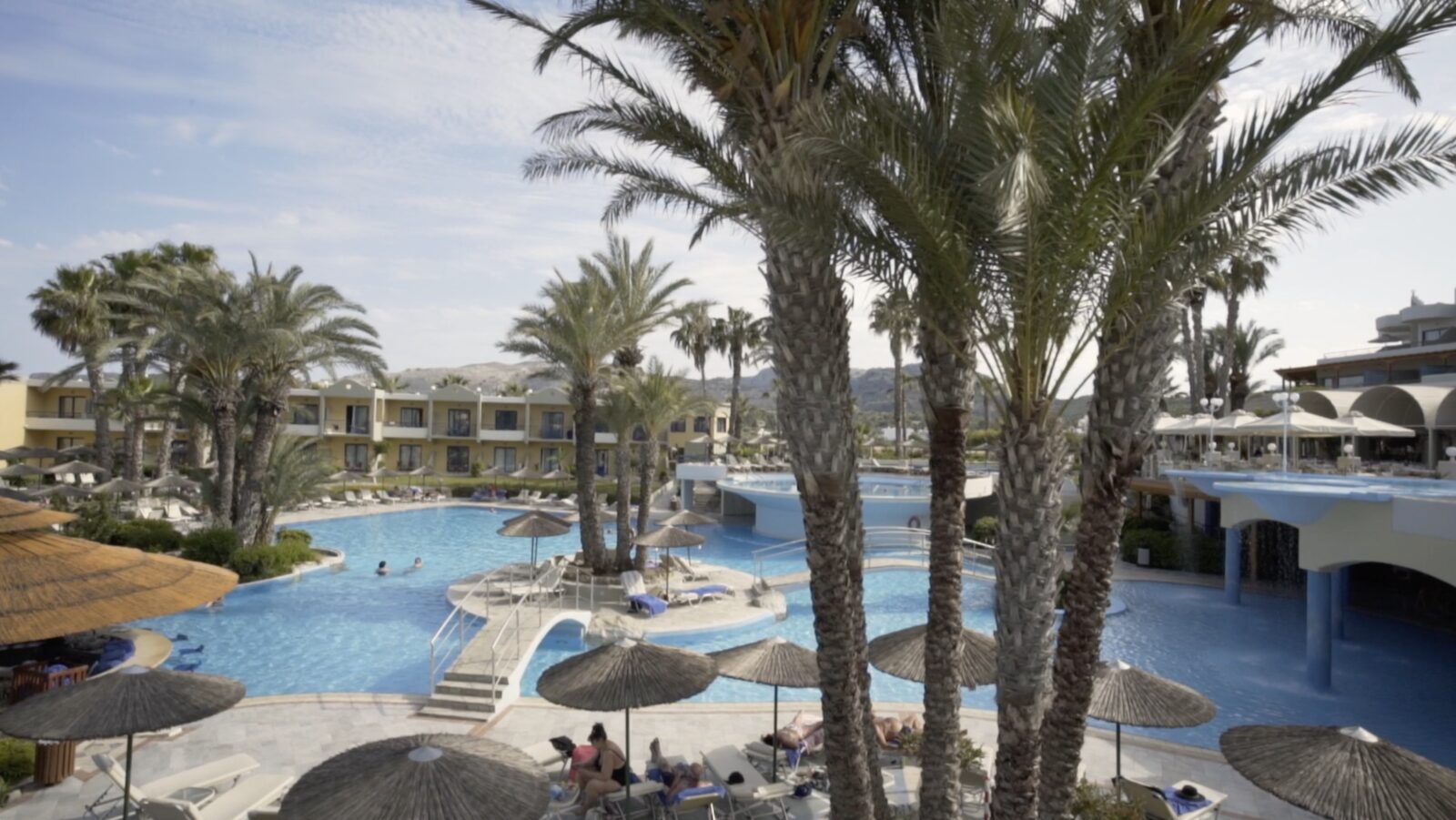 Atrium Palace pools under the palms, Kalathos Bay