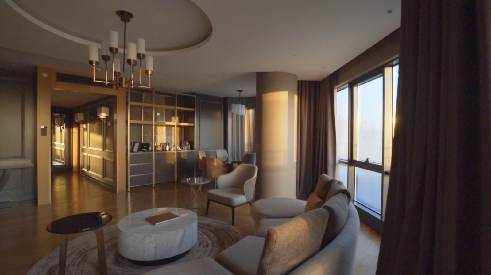 The suite lounge, warm wood and quiet