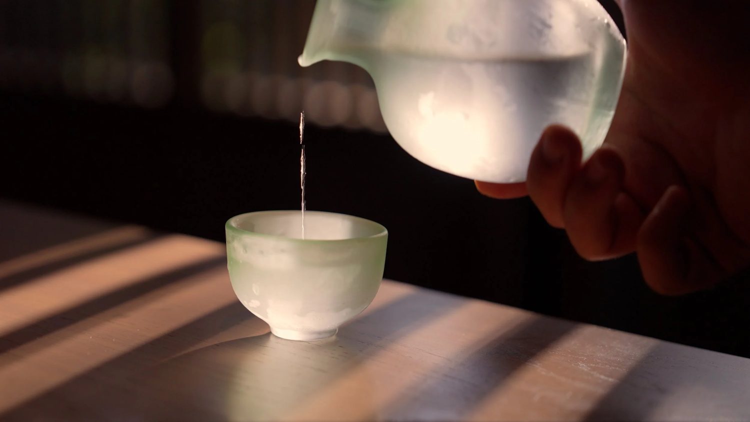 Tea poured slow in the morning light