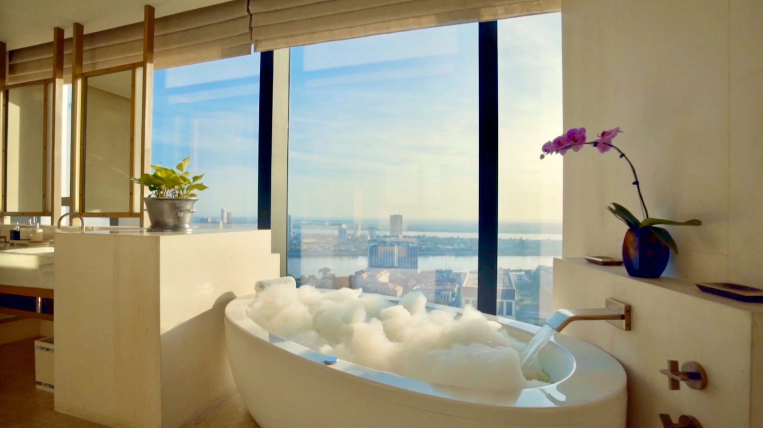 A freestanding bath above the city