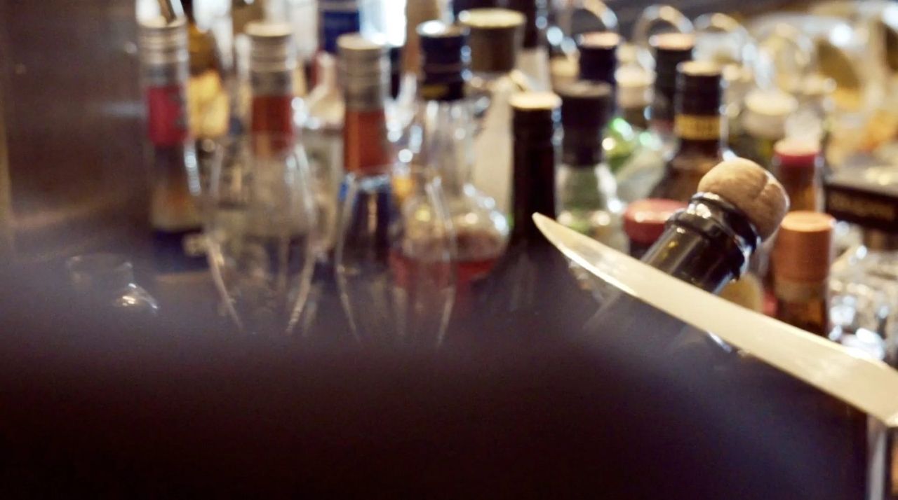 Cinematic low-light hotel bar — the look that makes a property feel like a film set