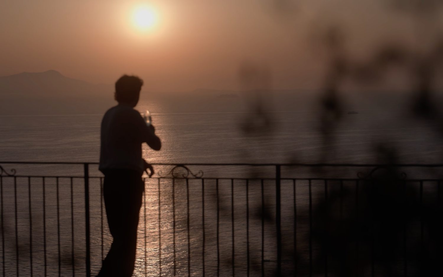 Evening on the balcony, the sun setting over the Gulf